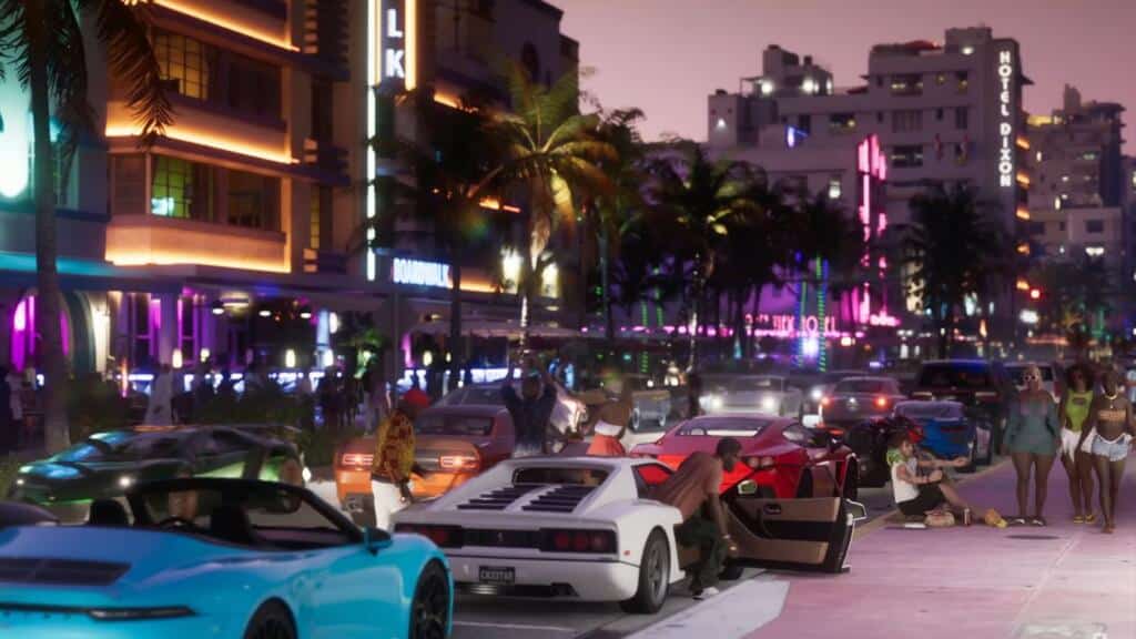 An image showing Vice city at night, bustling with people and cars.