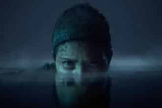 An image showing a still from Hellblade 2 game in which Senua's face is partially submerged in water.