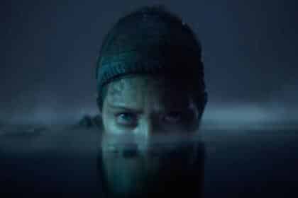 An image showing a still from Hellblade 2 game in which Senua's face is partially submerged in water.