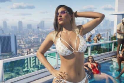 An image showing a woman standing on a rooftop pool soaking the sun, wearing a white-colored bikini.